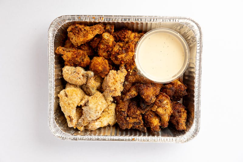 Crispy wings appetizer with dipping sauce